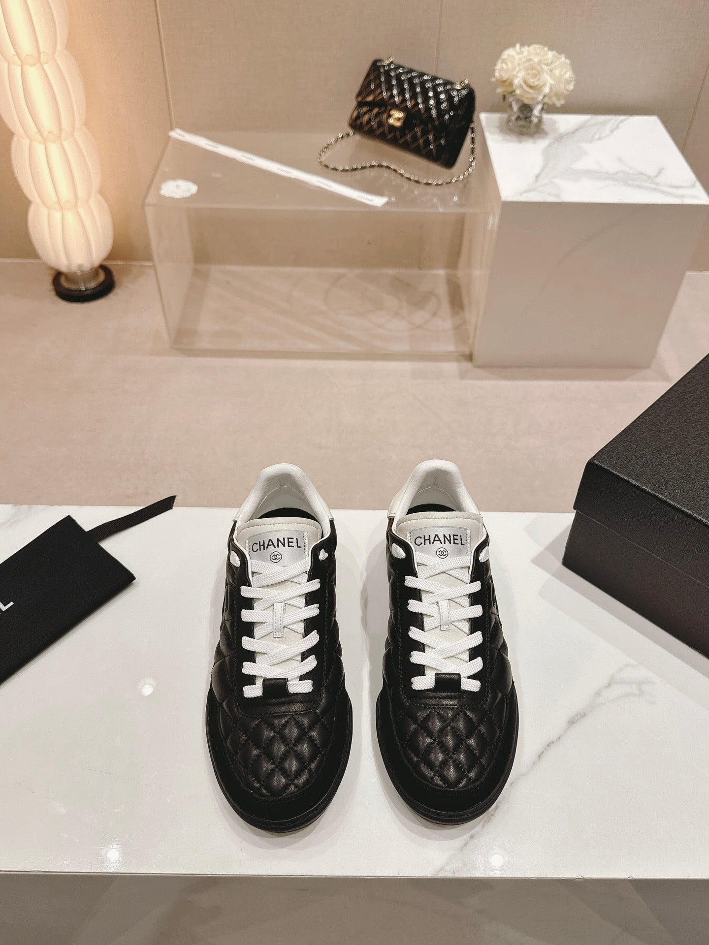 CHANEL SNEAKERS IN GLOSSY BLACK LAMBSKIN
